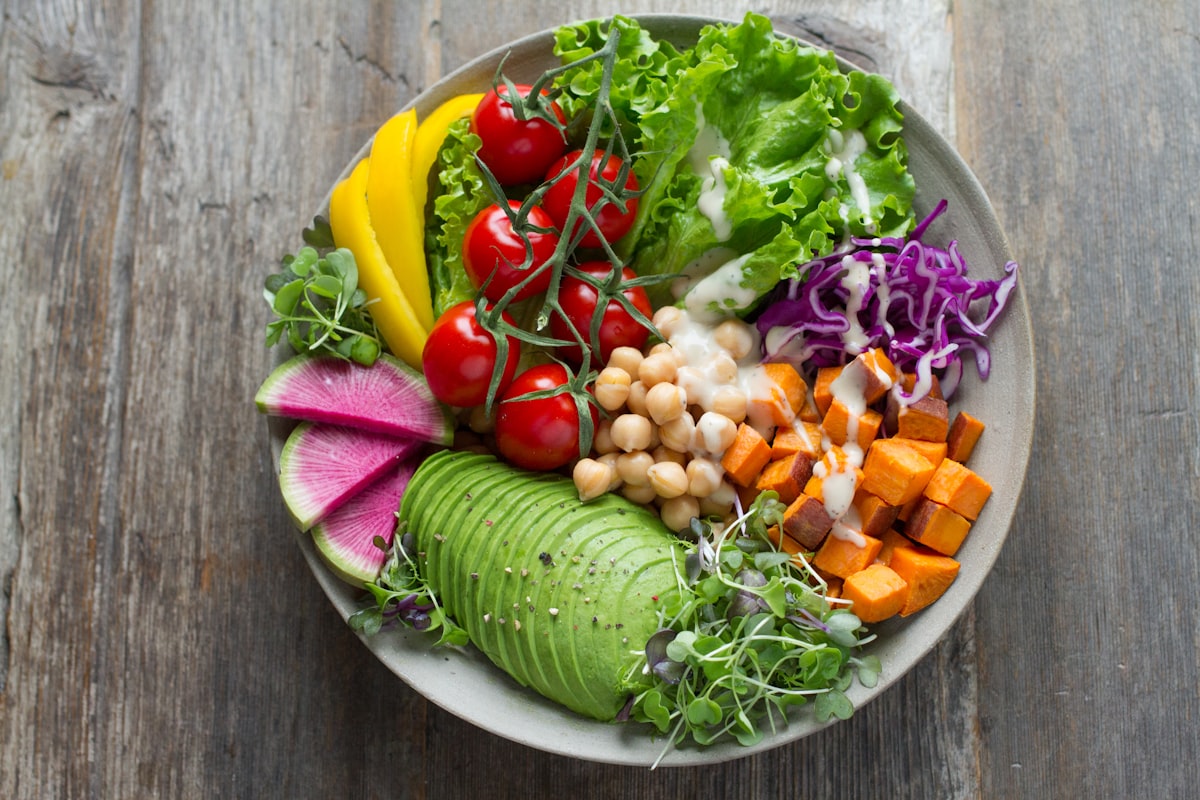Colorful plate with balanced portions of vegetables, lean protein, and whole grains